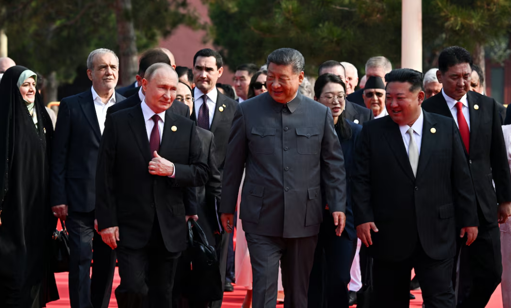 Xi Jinping says world faces ‘peace or war’, as Vladimir Putin and Kim Jong-un join him for military parade