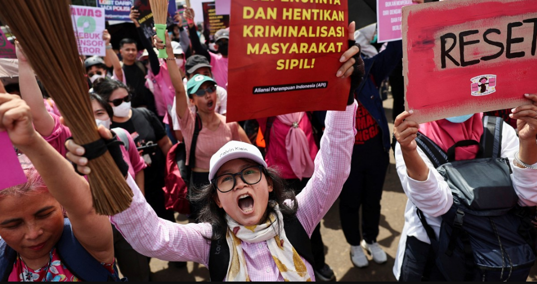 Brandishing brooms, Indonesian women join Jakarta protests